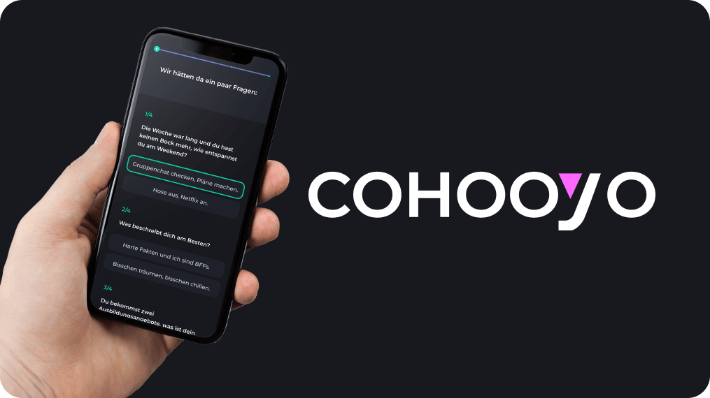 A hand holding a smartphone displaying a quiz interface on the Cohooyo platform, with questions aimed at identifying the user's preferences and strengths