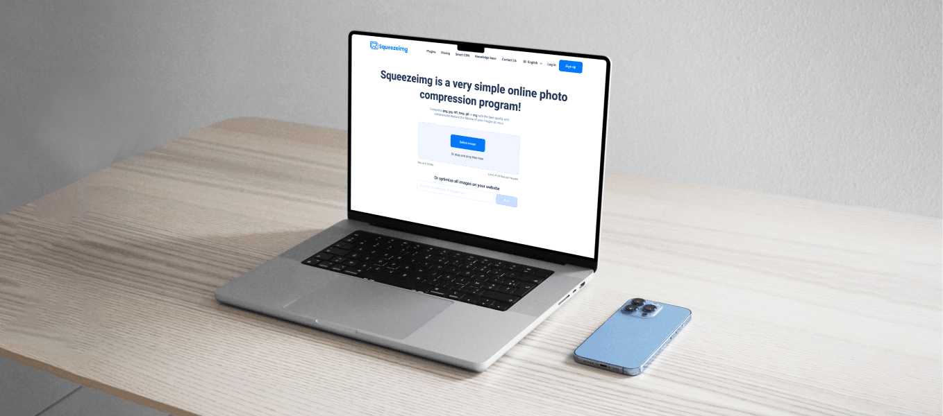 A laptop displaying the Squeezeimg website, an online photo compression tool