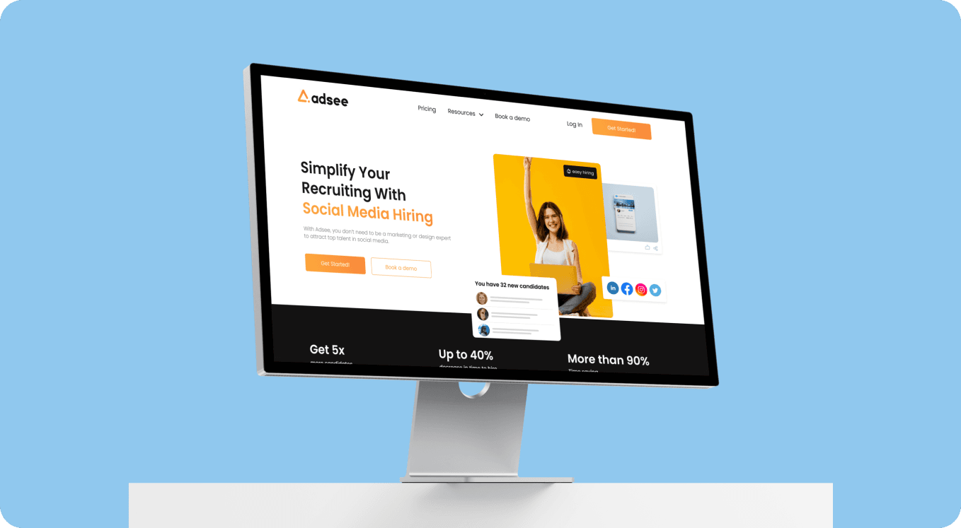Desktop monitor showing Adsee website highlighting social media hiring services with a cheerful woman and statistics on recruitment efficiency