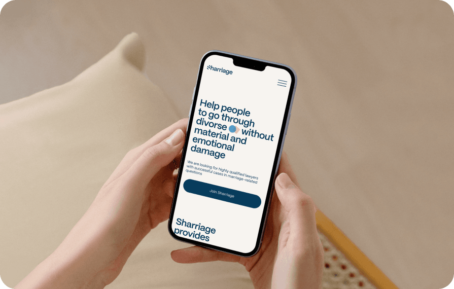 A person holds a smartphone displaying the Sharriage platform, offering legal services to help people through divorce without material and emotional damage